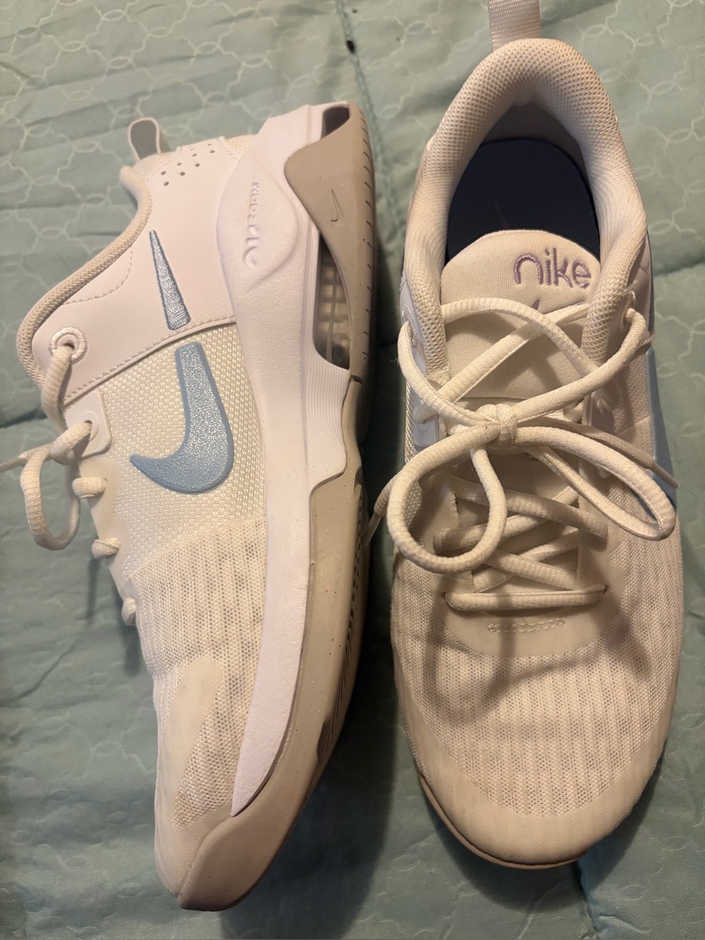 Nike Women's White Athletic Sneakers with Light Blue Swoosh